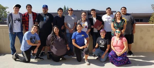 Fifteen I-Connect students line up on the UCR campus for a group photo