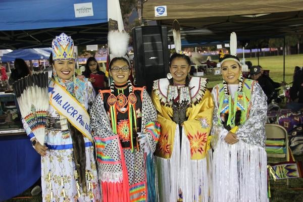 Ms. UCR Pow Wow stands with three other contestants