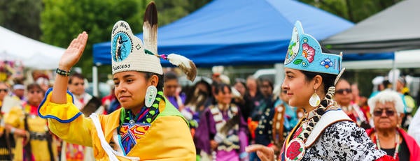 The NASP Pow Wow Princess waves to the crowd at UC Riverside