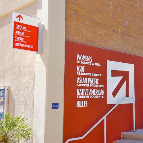 An outdoor sign of second floor Costo Hall offices, including NASP, Asian Pacific Student Programs, and the Women's Resource Center