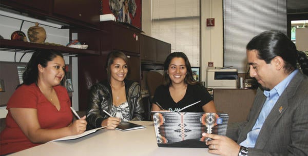 Staff members meet in the NASP office on the UC Riverside campus