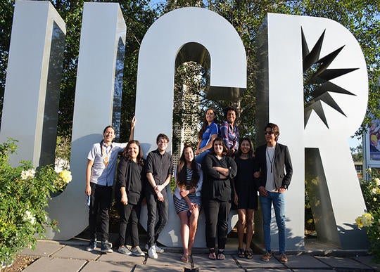 NASP students take a photo opportunity in front of the iconic UCR letters