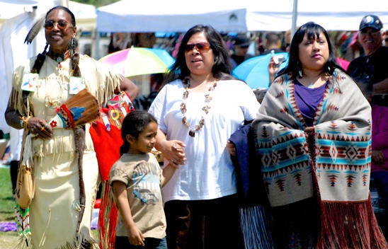 Four participants enjoy the sights and sounds of the NASP Pow Wow